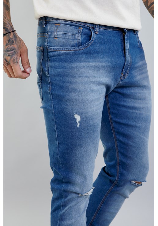 Calça Jeans Masculina Skinny com Recortes no Joelho Lavagem Média